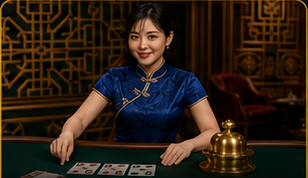 Female card dealer in a blue cheongsam at a live casino Fan Tan table.